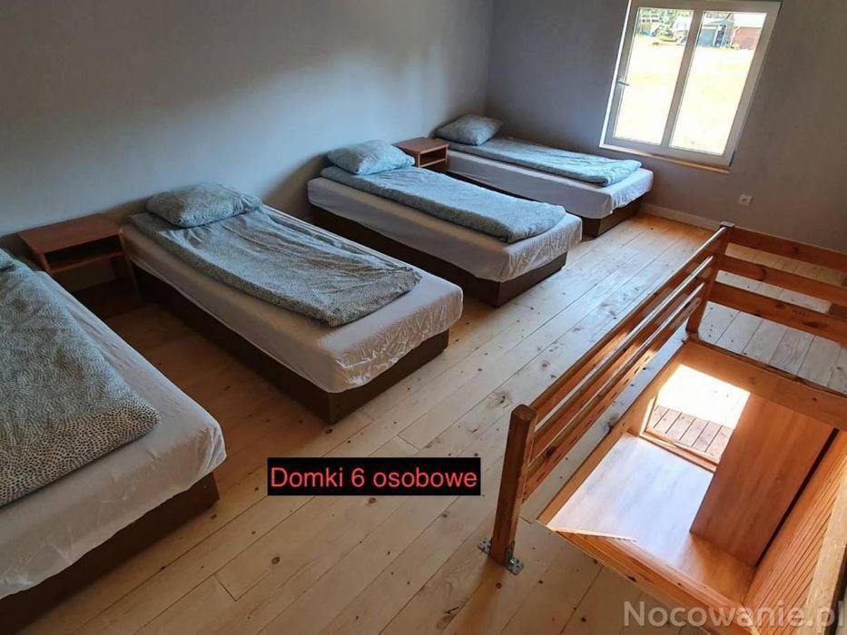 Domki Pod Lasem Mrzeżyno Esterno foto